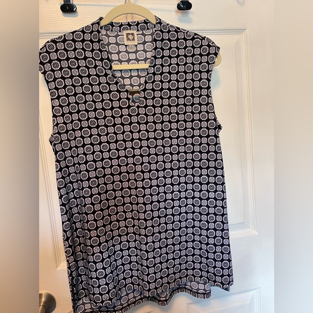 Navy blue and white blouse with metal cleavage clasp